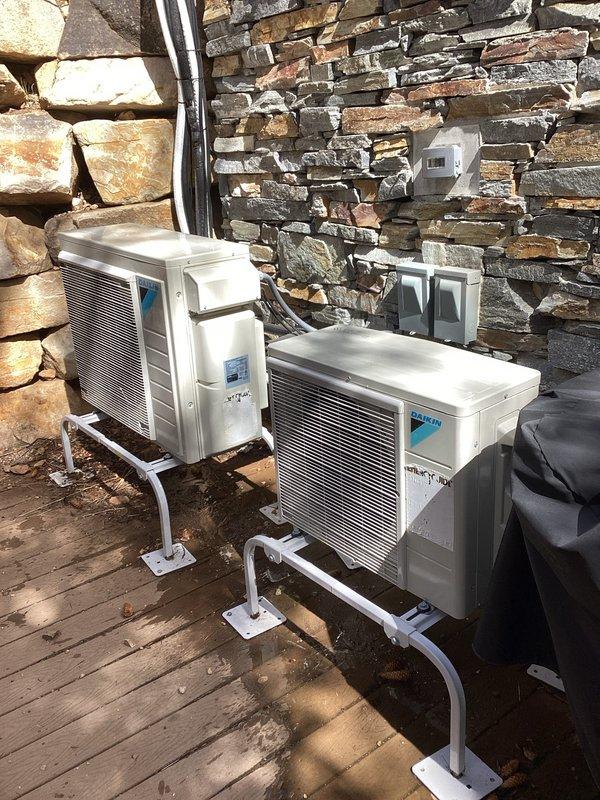 Completed annual AC maintenance tune-up on residential multi-zone system with units located on second and third floors. Inspected and serviced two Daikin outdoor condenser units mounted on deck, checking refrigerant lines, electrical connections, and overall unit operation. Inspected air filtration system and noted dust accumulation on return air filter requiring attention. All equipment operational and performing within normal parameters at time of service.