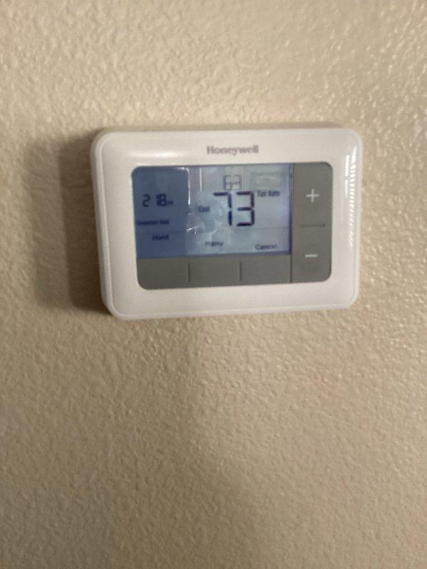 Completed routine air conditioning maintenance as part of membership service. Inspected outdoor condensing unit located at rear of property and verified proper operation. Performed standard AC tune-up procedures including checking refrigerant levels, cleaning condenser coils, inspecting electrical connections, and testing thermostat functionality. Verified Honeywell digital thermostat displaying proper temperature readings and confirmed system cooling effectively. Inspected basement furnace installation and associated ductwork for upcoming heating season readiness. All equipment operating within normal parameters with no deficiencies noted.