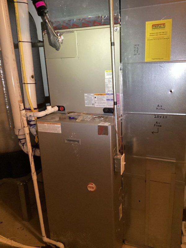 Completed routine air conditioning maintenance as part of membership service. Inspected outdoor condensing unit located at rear of property and verified proper operation. Performed standard AC tune-up procedures including checking refrigerant levels, cleaning condenser coils, inspecting electrical connections, and testing thermostat functionality. Verified Honeywell digital thermostat displaying proper temperature readings and confirmed system cooling effectively. Inspected basement furnace installation and associated ductwork for upcoming heating season readiness. All equipment operating within normal parameters with no deficiencies noted.
