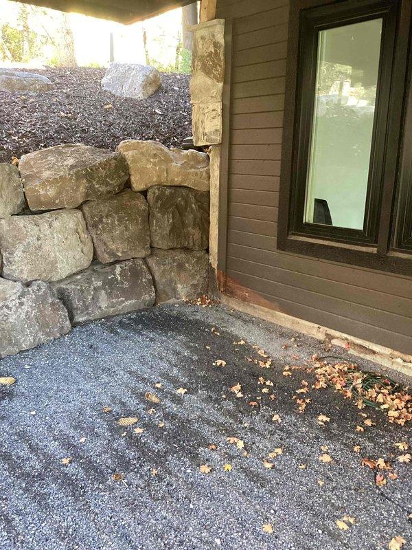 Performed site assessment for mini-split heat pump installation at residential property. Evaluated existing electrical panel capacity and determined requirements for dedicated circuit breaker installation to support new mini-split system. Assessed exterior routing path from main electrical panel to outdoor disconnect location, accounting for building siding and stone retaining wall obstacles. Provided estimate for installation of appropriately sized breaker, wire run through exterior walls, and connection to outdoor disconnect box per manufacturer specifications and local electrical code requirements.