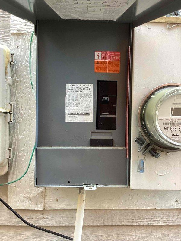 Completed annual electrical maintenance visit including comprehensive inspection of main electrical panel, circuit breakers, and exterior meter installation. Verified proper operation of all breaker switches, confirmed secure mounting of panel and meter assembly on exterior wall, and inspected electrical conduit connections and wiring runs. All components found to be functioning within normal parameters with no immediate safety concerns identified.