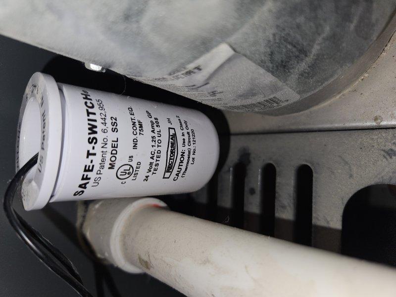 Responded to no-cooling call on 4-5 year old basement system with intermittent cycling and red indicator light on furnace. Diagnosed tripped SAFE-T-SWITCH SS2-95P condensate overflow safety device causing system lockout. Verified supply air temperature at 53.3°F after clearing condensate blockage and resetting safety switch, restoring normal system operation.