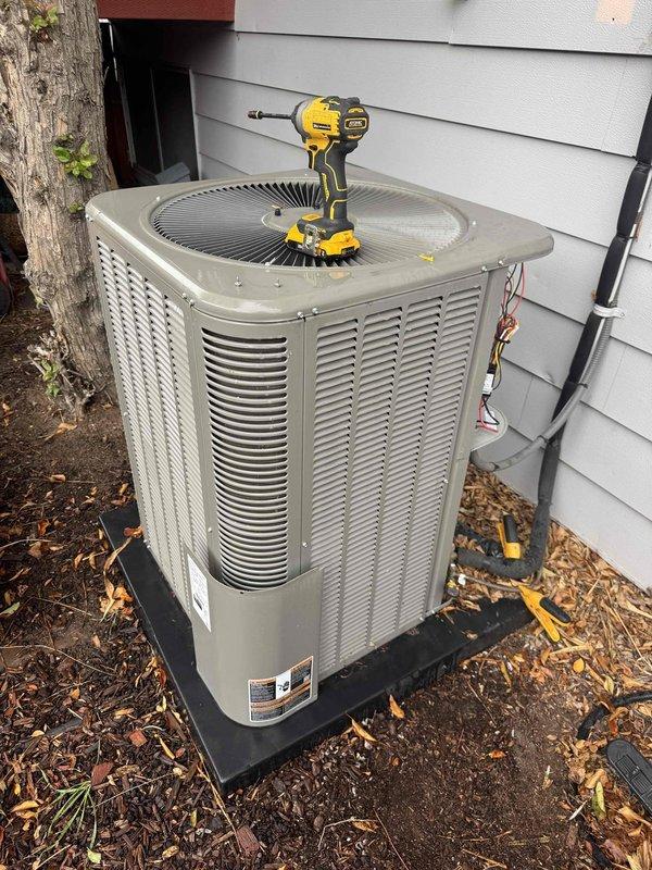 Completed routine air conditioning tune-up and maintenance as part of membership service. Performed comprehensive inspection of outdoor condensing unit, including removal of access panel to examine electrical components, capacitor, and wiring connections. Verified all electrical connections were secure and properly terminated, with no signs of wear or damage to control wiring. Inspected capacitor for proper operation and mounting. Cleaned exterior unit and removed accumulated leaves and debris from base and surrounding area. Checked refrigerant line insulation for integrity along exterior wall penetration. Verified condenser fan operation and grille condition. All components found to be in good working order with no immediate repairs required. System operating within normal parameters.