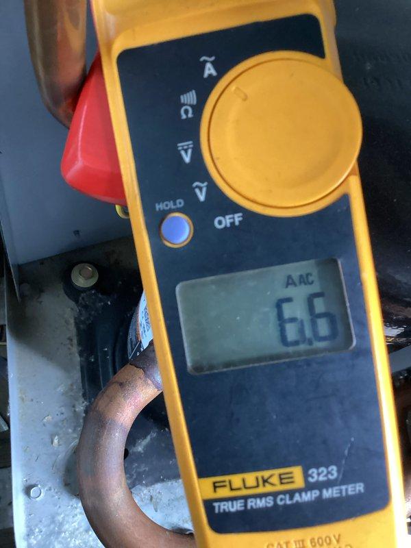 Completed Gold Cooling Maintenance on single 12-13 year old system located on balcony/utility closet. Performed comprehensive inspection and preventative maintenance procedures including electrical testing with clamp meter showing 66 AAC current draw, temperature measurements reading 212°F, and standard system diagnostics. All components operating within normal parameters with no issues identified or repairs required at time of service.
