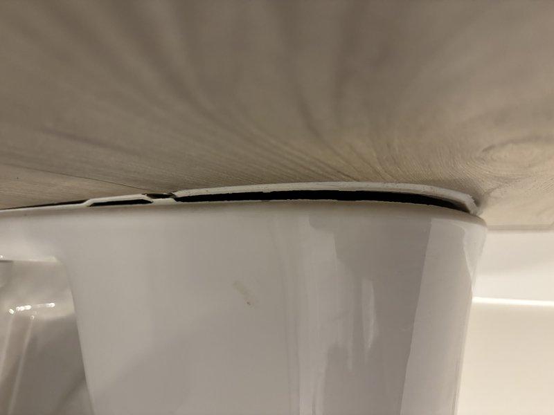 Responded to service call for toilet leaking around the base. Upon inspection, identified compromised wax ring seal between toilet fixture and closet flange causing water seepage onto tile flooring. Removed toilet by disconnecting water supply line and unbolting fixture from floor mounting bolts. Scraped and cleaned old wax ring residue from both the closet flange and toilet horn. Inspected flange for damage or deterioration and confirmed structural integrity. Installed new wax ring with integrated polyethylene flange for enhanced seal. Repositioned toilet fixture, ensuring proper alignment with closet bolts, and secured with new mounting hardware torqued to manufacturer specifications. Reconnected water supply line with new compression fitting. Restored water supply, filled tank, and conducted multiple flush cycles to verify proper operation and confirm elimination of base leak. Inspected surrounding floor area for water damage and confirmed no moisture present. Fixture now operating 