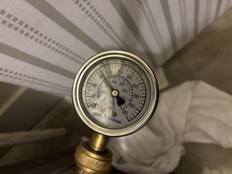 Responded to no hot water complaint on 5-year-old tanked water heater located in garage. Upon arrival, discovered gas supply had been shut off to unit. Performed diagnostic inspection of water heater system, checked gas line connections, pressure readings, and safety controls. Verified all plumbing connections and fittings were secure, inspected temperature and pressure relief valve, and assessed overall system functionality to restore hot water service to the home.