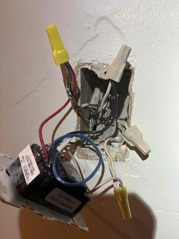 Responded to non-functioning three-way lighting circuit on staircase between first and second floors involving legacy Control4 smart switch system. Upon inspection, found multiple conductors in electrical box including travelers, neutrals, and line voltage wiring with existing wire connections showing signs of age. Diagnosed failed Control4 smart switches likely due to power surge or component failure over time. Removed old smart switch devices, verified circuit integrity and proper wire connections, and installed replacement switching solution compatible with existing three-way configuration and multi-conductor wiring setup in wall box.
