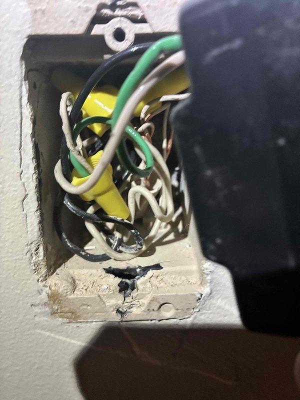 Responded to non-functioning three-way lighting circuit on staircase between first and second floors involving legacy Control4 smart switch system. Upon inspection, found multiple conductors in electrical box including travelers, neutrals, and line voltage wiring with existing wire connections showing signs of age. Diagnosed failed Control4 smart switches likely due to power surge or component failure over time. Removed old smart switch devices, verified circuit integrity and proper wire connections, and installed replacement switching solution compatible with existing three-way configuration and multi-conductor wiring setup in wall box.
