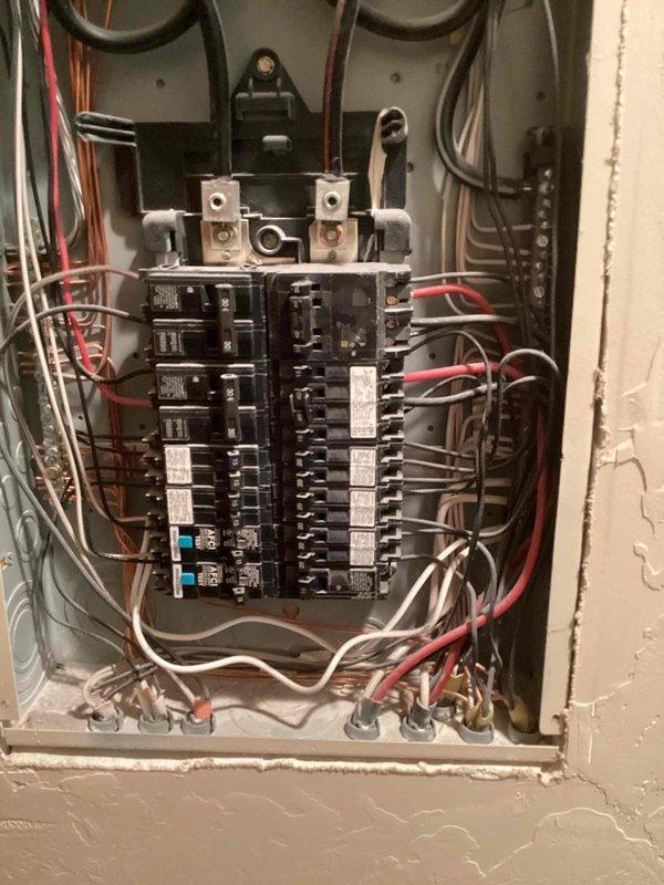 Completed routine electrical maintenance inspection for multi-unit residential property. Inspected exterior electrical meter panel containing multiple Itron digital utility meters serving units A1, C1, and H, verifying proper operation and secure mounting. Performed interior inspection of main electrical panel, checking all circuit breakers for proper function, examining bus bar connections, and verifying wire terminations were secure with no signs of overheating or damage.