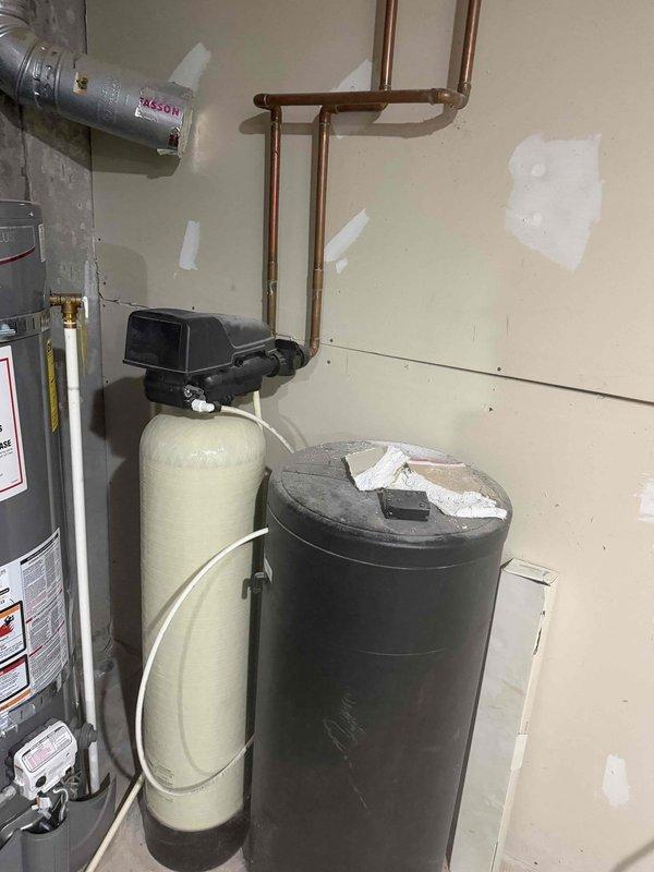 Responded to residential flooding incident requiring water line replacement. Installed new main water supply line to restore service following leak damage in utility area. Copper piping was run and secured along basement wall near water heater and water softener system. All connections were properly soldered, pressure tested, and verified for leaks to ensure system integrity and code compliance.