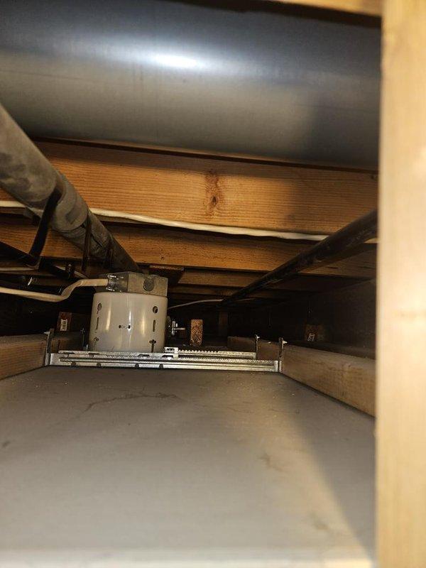 Responded to service call for gas water heater replacement due to tank failure with bottom leak on unit installed in 2019. Performed inspection of existing gas tank water heater and confirmed active leak from bottom of tank requiring immediate replacement. Assessed attic installation location, existing gas line connections, venting configuration, and available space for equipment options. Provided customer with replacement options including both traditional gas tank water heater and tankless water heater alternatives, discussing capacity requirements, installation considerations, and equipment specifications for each system type.