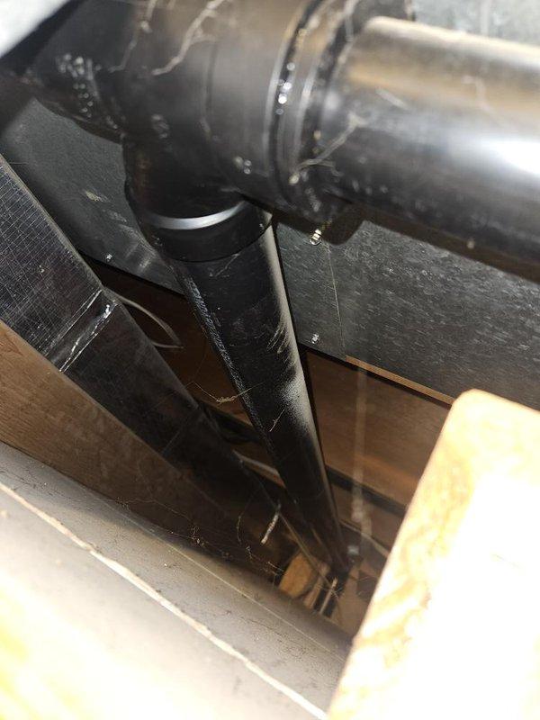 Responded to service call for gas water heater replacement due to tank failure with bottom leak on unit installed in 2019. Performed inspection of existing gas tank water heater and confirmed active leak from bottom of tank requiring immediate replacement. Assessed attic installation location, existing gas line connections, venting configuration, and available space for equipment options. Provided customer with replacement options including both traditional gas tank water heater and tankless water heater alternatives, discussing capacity requirements, installation considerations, and equipment specifications for each system type.