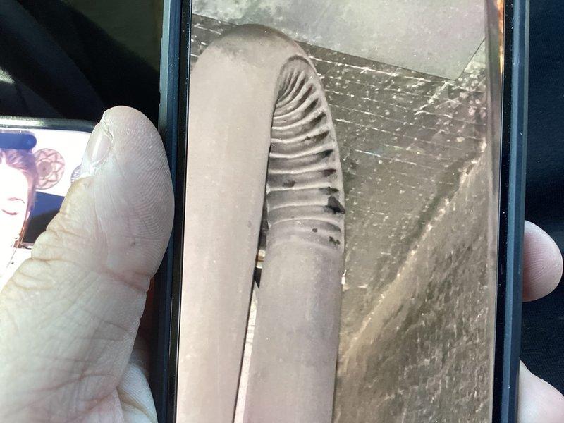 Responded to no heat call on 12-15 year old furnace system located in basement. Upon arrival, confirmed heating element operational but blower motor failing to circulate heated air throughout ductwork. Inspected and photographed HVAC ductwork and system components to document existing conditions and airflow issues.