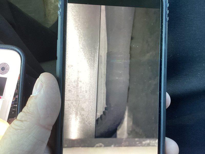 Responded to no heat call on 12-15 year old furnace system located in basement. Upon arrival, confirmed heating element operational but blower motor failing to circulate heated air throughout ductwork. Inspected and photographed HVAC ductwork and system components to document existing conditions and airflow issues.