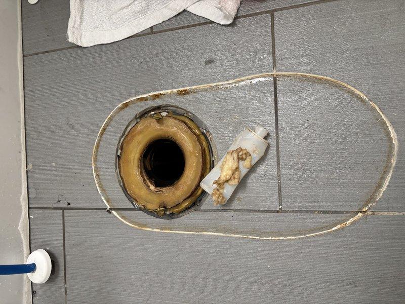 Responded to callback for recurring toilet stoppage previously augured during initial service call. Removed toilet from flange to access and clear obstruction that could not be resolved through auguring alone. Identified foreign object lodged in trapway causing repeated blockage. Extracted debris, cleared drain line, and inspected toilet bowl and internal passages for damage. Replaced wax ring seal at flange connection and reinstalled toilet to proper specifications. Tested flush operation and verified full drainage with no backup or slow flow issues.