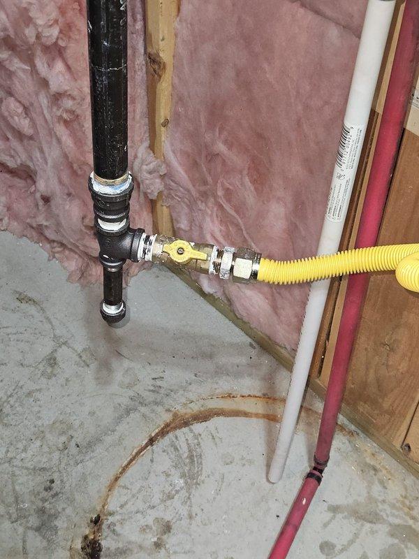 Successfully removed two existing 50-gallon tank water heaters and replaced with a new Rinnai tankless water heater system with descaler unit. Installation included routing new PVC venting through wall framing, installing gas line with flexible connector and shut-off valve, configuring water supply lines with copper and PEX piping, and ensuring proper condensate drainage. All connections tested and verified for safe operation, with unit commissioned and ready for service.
