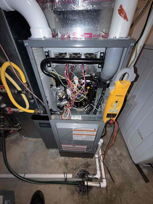 Completed membership fall heating tune-up on residential gas furnace. Performed comprehensive inspection of all internal components including gas valve assembly, ignition system, control boards, and electrical connections. Verified proper temperature rise across heat exchanger, tested all safety controls, and confirmed burner operation. Inspected venting system and PVC condensate drainage. Unit operating within manufacturer specifications with no issues identified.