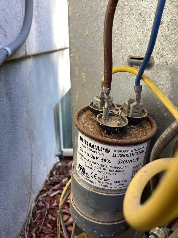 Completed annual cooling maintenance on 14-year-old air conditioning system. Performed comprehensive inspection including amperage draw testing which measured 49 AAC, inspected dual run capacitor rated at 35x5.0uF 370VAC showing age-related surface corrosion and terminal discoloration, and evaluated all electrical connections and system components. Unit operating within normal parameters with no issues reported or found during maintenance visit.