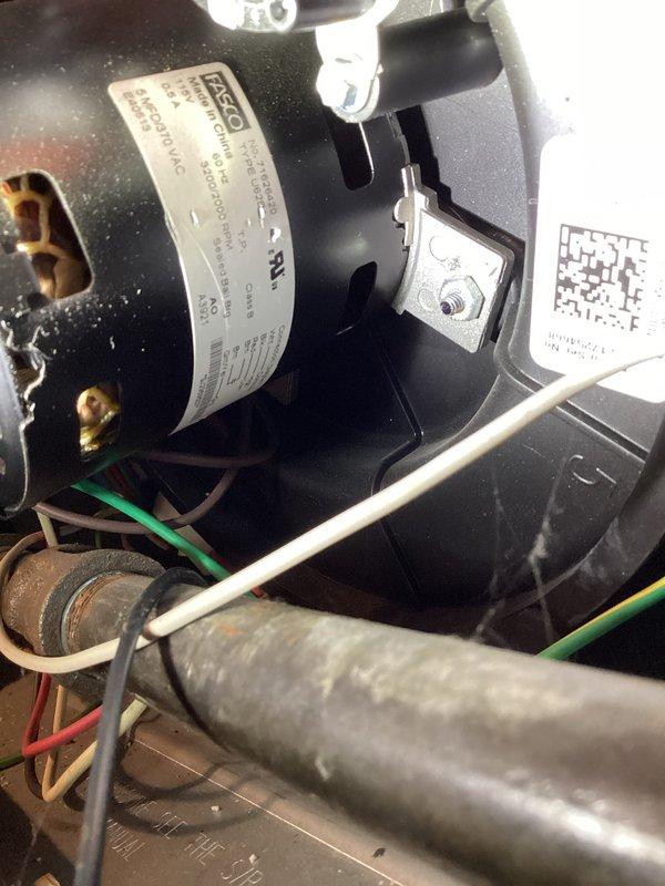 Completed comprehensive annual maintenance inspection on residential HVAC system including blower motor assembly, electrical connections, and Daikin thermostat verification. Inspected internal furnace components, verified proper motor operation and mounting hardware integrity, checked all wire connections and safety controls, and confirmed thermostat functionality displaying 69°F with humidity monitoring at 47% in air circulation mode.