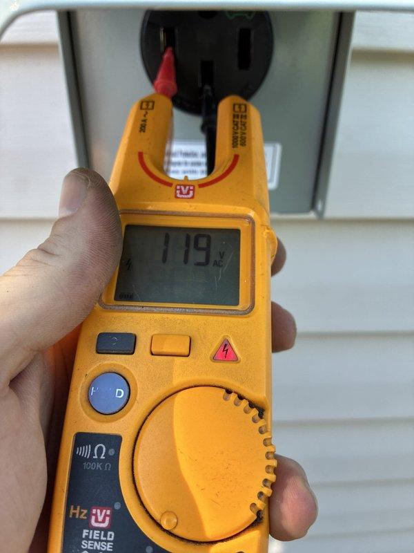 Conducted on-site evaluation for electric vehicle charger installation on exterior side wall of residence. Verified existing electrical service capacity by testing voltage at 119V and assessed current electrical panel configuration and exterior disconnect box. Provided detailed estimate for EV charger installation including necessary electrical upgrades, dedicated circuit requirements, conduit routing from main panel to proposed charging location, and proper outdoor-rated equipment specifications.