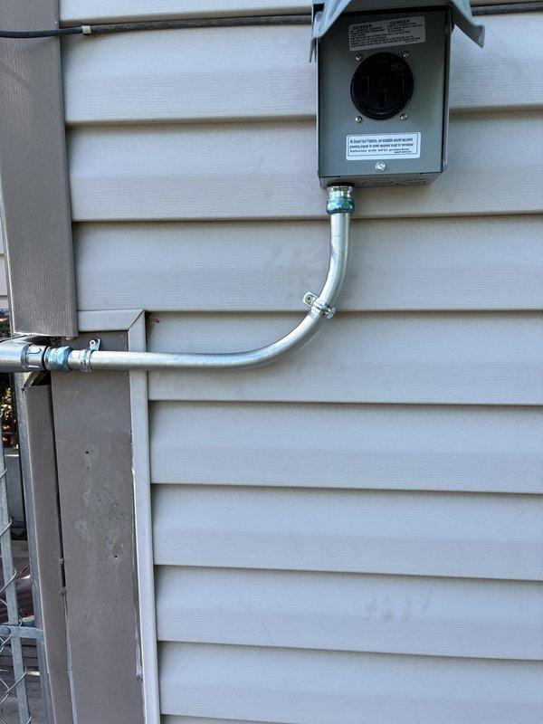 Conducted on-site evaluation for electric vehicle charger installation on exterior side wall of residence. Verified existing electrical service capacity by testing voltage at 119V and assessed current electrical panel configuration and exterior disconnect box. Provided detailed estimate for EV charger installation including necessary electrical upgrades, dedicated circuit requirements, conduit routing from main panel to proposed charging location, and proper outdoor-rated equipment specifications.