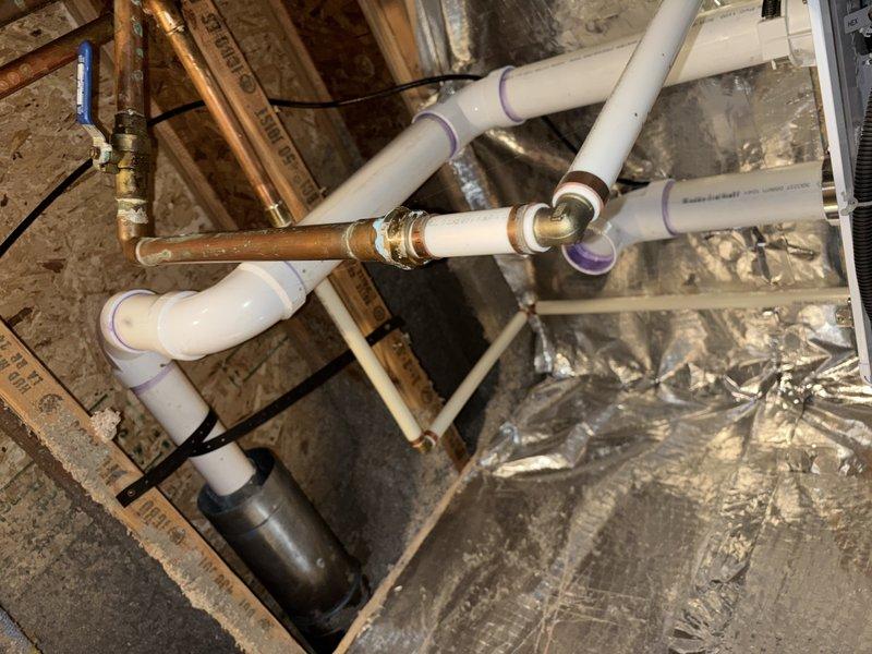 Responded to reported gas odor occurring during system startup on 5-7 year old Navien tankless water heater located in basement utility room. Performed comprehensive system inspection and diagnostics to evaluate combustion cycle and ventilation components. Inspected gas connections, burner assembly, and heat exchanger for proper operation and signs of incomplete combustion that could cause odor during purge cycle. Verified all plumbing connections including copper water supply lines and PVC venting system for proper installation and integrity. Examined air intake and exhaust venting configuration to ensure adequate combustion air supply and proper draft. Tested unit through multiple startup cycles to observe purge sequence and identify source of gas smell. Confirmed all safety devices and flame sensors functioning correctly.