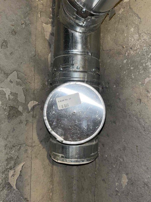 Responded to a leaking 6-year-old tanked water heater with leak originating from the top of the unit. Upon inspection, identified the pressure relief valve (PRV) as the probable source of the leak. Noted that an expansion tank had been previously installed on top of the water heater. Assessed the PRV assembly and pressure gauge components to determine necessary repairs for resolving the water leakage issue.