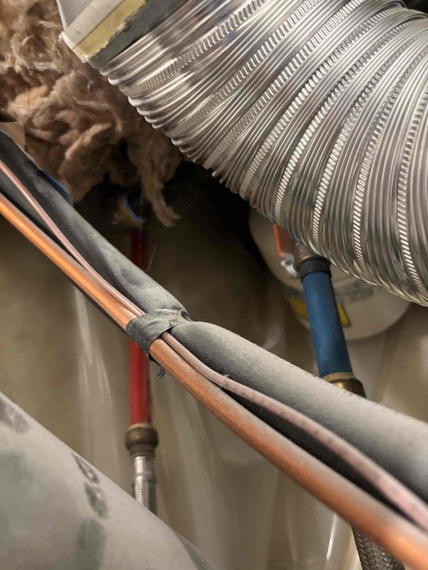 Responded to no hot water condition with red flashing diagnostic light on tanked water heater aged 6+ years. Found gas supply had been shut off and subsequently reconnected, but unit continued displaying single red flash error code. Inspected gas connections, verified proper gas flow through yellow flexible gas line, and examined control module and ignition system. Evaluated water supply connections, pressure relief valve, and all associated plumbing connections for proper operation. Documented equipment condition and diagnostic indicators for further troubleshooting recommendations.