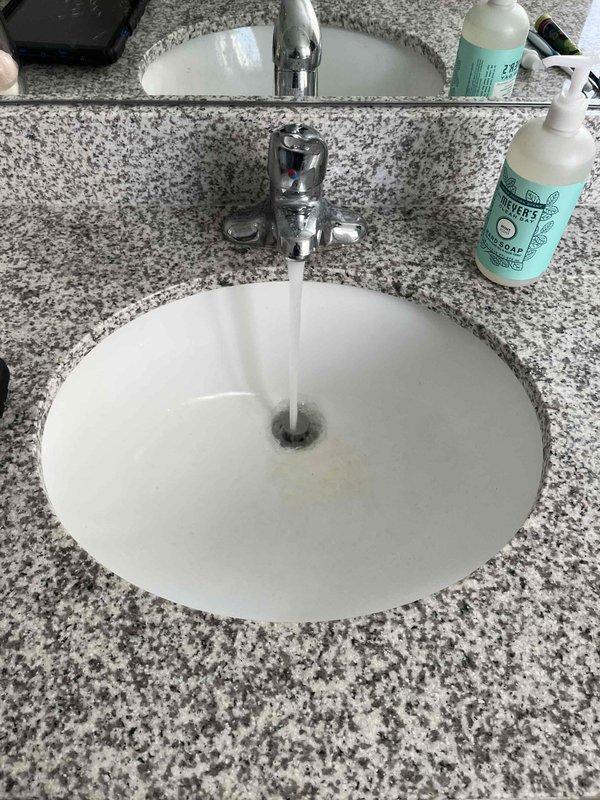 Completed annual plumbing maintenance inspection as part of membership plan. Performed comprehensive pressure test on water supply system, conducted water purity testing, and executed complete water heater flush. Inspected bathroom plumbing fixtures including chrome single-handle faucet and drain assembly at vanity sink with granite countertop, verified proper water flow and drainage. Examined laundry area plumbing connections including wall-mounted washing machine hookup with hot and cold water supply valves, braided stainless steel supply lines, and corrugated drain hose. All fixtures, connections, and plumbing systems found to be operating within normal parameters with no leaks or deficiencies noted.