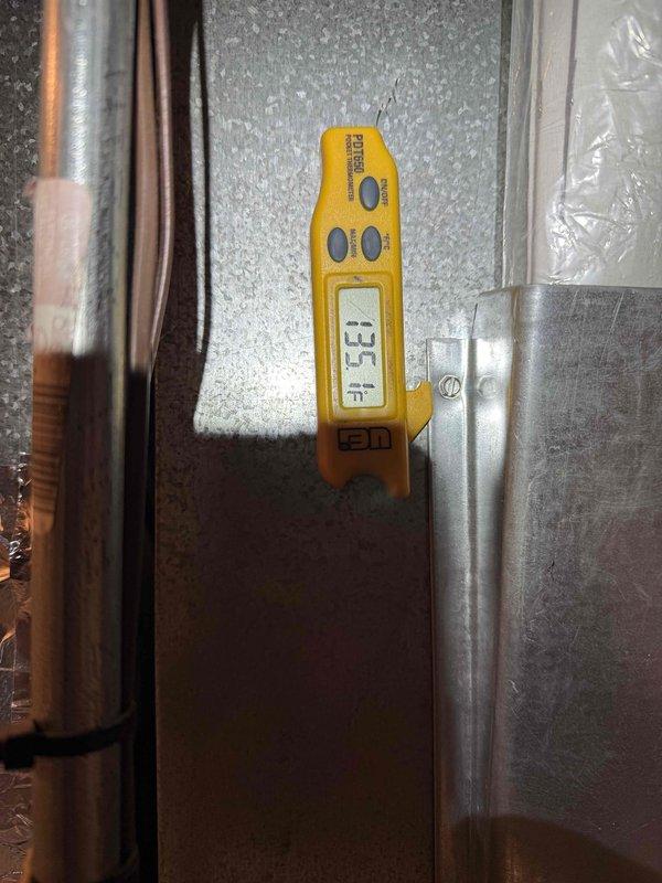 Completed Green Shield heating maintenance on single-system furnace unit located in closet. Performed comprehensive inspection of blower motor assembly, heat exchanger, burner components, and control board. Investigated reported water leak issue, inspected condensate system and heat exchanger for potential breach points. Verified all electrical connections, safety controls, and ignition components functioning properly. Documented temperature differential reading of 13.3 degrees across system. Noted minor surface corrosion on heat exchanger panels and general dust accumulation consistent with 5-9 year old unit. All wiring connections secure with proper color-coded routing throughout furnace compartments. Unit operational at time of service completion.