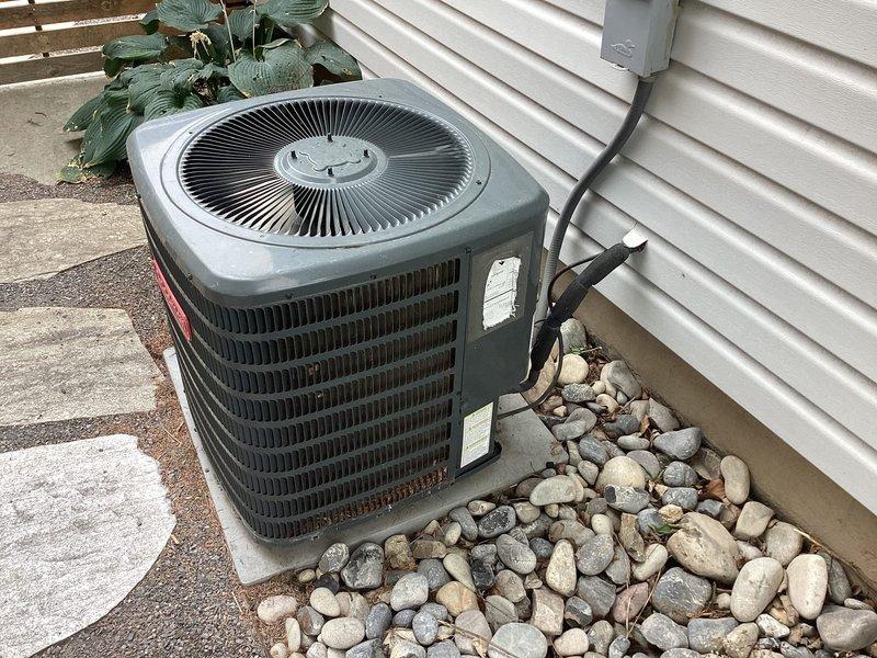 Responded to no cooling complaint on residential split system approximately 6-9 years old. Customer reported evaporator coil repeatedly freezing up despite multiple cleanings, adequate airflow, and new filter replacement, with suspected refrigerant leak. Upon arrival, performed diagnostic evaluation of outdoor condensing unit and system operation. Utilized Testo 558s refrigeration analyzer to measure system pressures, temperatures, superheat, and subcooling values to assess refrigerant charge and identify potential leak source. Documented equipment condition and diagnostic readings for service records.