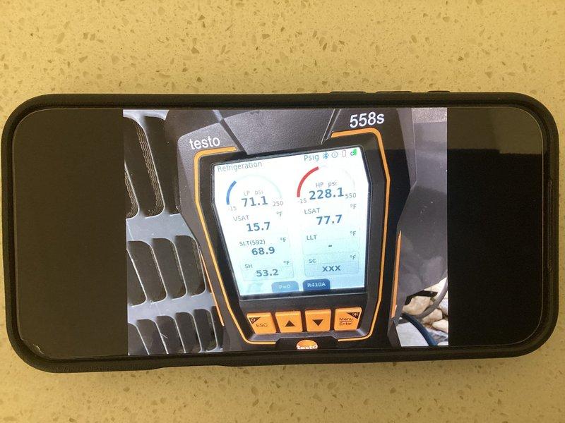 Responded to no cooling complaint on residential split system approximately 6-9 years old. Customer reported evaporator coil repeatedly freezing up despite multiple cleanings, adequate airflow, and new filter replacement, with suspected refrigerant leak. Upon arrival, performed diagnostic evaluation of outdoor condensing unit and system operation. Utilized Testo 558s refrigeration analyzer to measure system pressures, temperatures, superheat, and subcooling values to assess refrigerant charge and identify potential leak source. Documented equipment condition and diagnostic readings for service records.