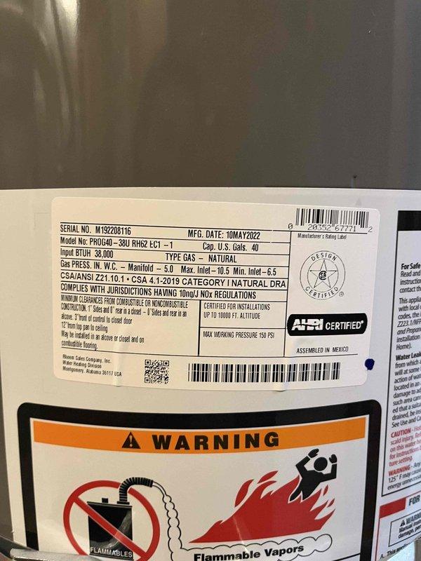 Responded to service call for 4-year-old Rheem Professional 40-gallon natural gas water heater (Model PROJ40-30U) experiencing inadequate heating issues since the previous weekend. Unit had never been serviced or flushed since installation in May 2022. Performed comprehensive diagnostic inspection and documented existing installation including expansion tank, PEX supply lines, and proper venting configuration in basement location.