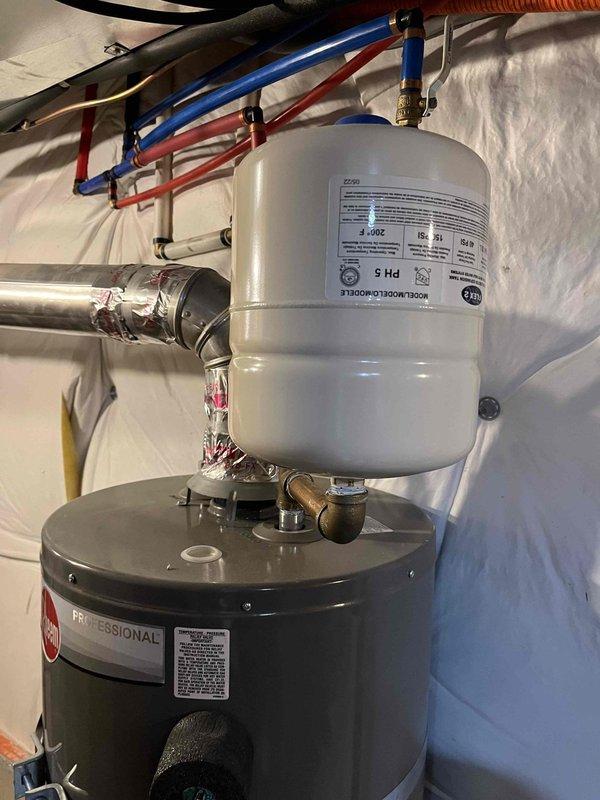 Responded to service call for 4-year-old Rheem Professional 40-gallon natural gas water heater (Model PROJ40-30U) experiencing inadequate heating issues since the previous weekend. Unit had never been serviced or flushed since installation in May 2022. Performed comprehensive diagnostic inspection and documented existing installation including expansion tank, PEX supply lines, and proper venting configuration in basement location.