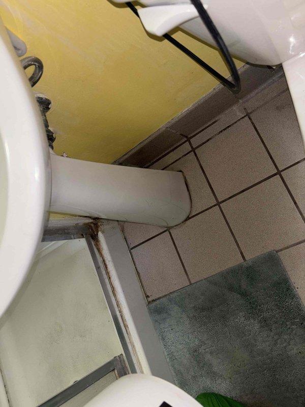 Responded to a bathroom pedestal sink drain stoppage that had been draining slowly before completely blocking. Cleared the obstruction using professional drain cleaning equipment after previous chemical treatment attempts were unsuccessful. Restored full drainage and verified proper water flow through the fixture.