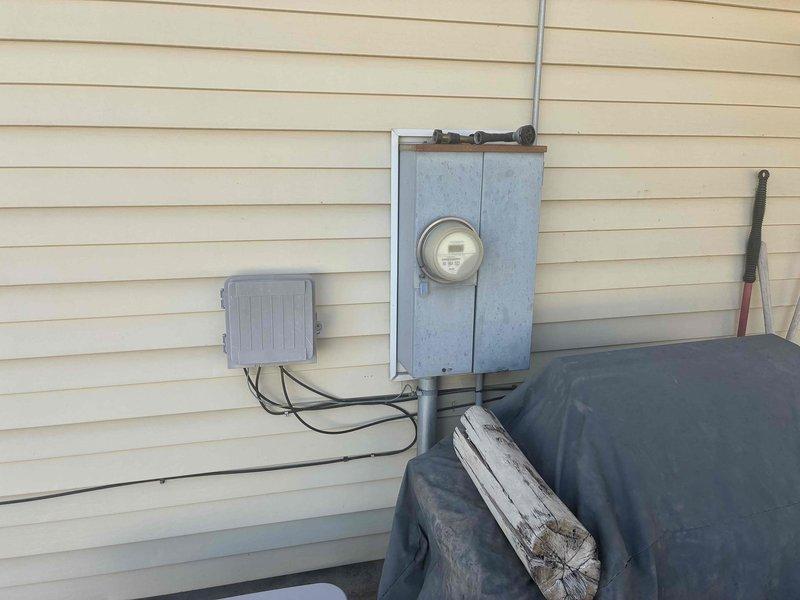Completed annual electrical maintenance inspection as part of membership plan. Performed comprehensive testing of electrical outlets throughout the residence using digital voltage meter, confirming proper voltage readings at 123.4V. Inspected main electrical meter panel and exterior service equipment, including meter box, disconnect switch, junction boxes, and associated conduit connections for proper operation and safety compliance.
