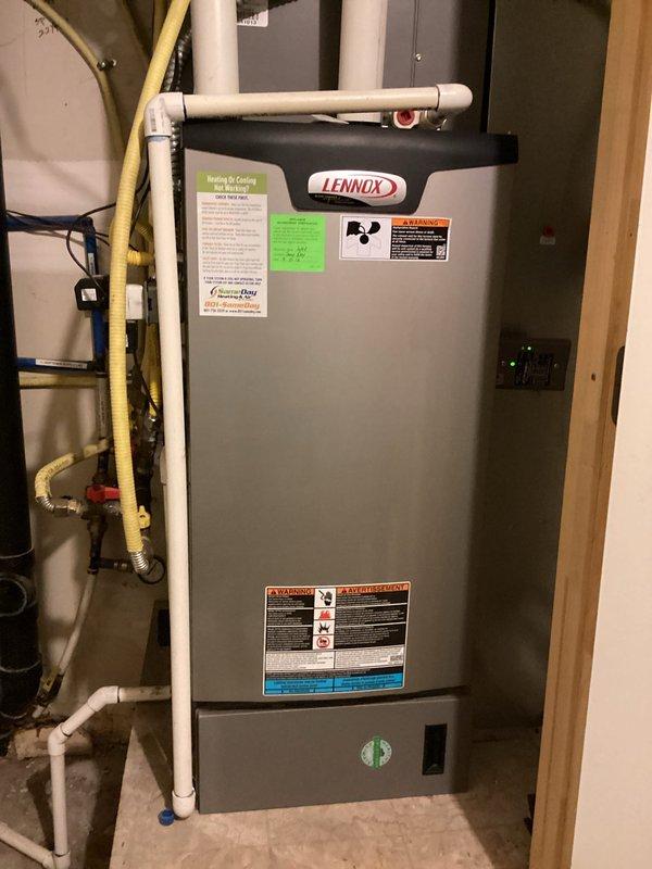 Completed scheduled heating maintenance on 10-11 year old Lennox furnace unit located in basement utility room. Performed comprehensive system inspection including electrical diagnostics, measured operating amperage at 50 AAC using clamp meter, verified all safety controls and combustion components functioning properly. System operating within manufacturer specifications with no issues reported or identified during inspection.