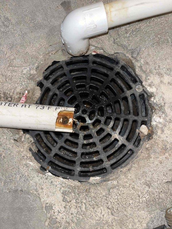 Responded to a clogged basement floor drain with water backup. Upon inspection, discovered a partially broken plastic cap lodged inside the drain assembly with organic buildup restricting water flow. Removed obstruction, cleared debris, and tested drain to confirm proper operation and drainage. Additionally performed maintenance on tankless water heater including flushing, descaling, and cleaning inlet filters. Verified home water pressure was within recommended specifications. All systems restored to normal function.