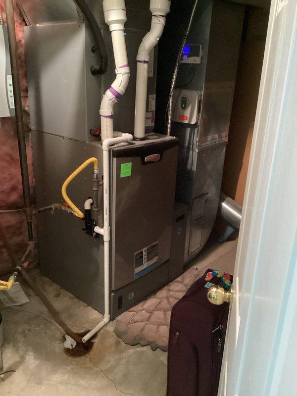Completed comprehensive Green Shield heating and cooling maintenance on a single-zone residential HVAC system with a 13-year-old air conditioning unit and 8-year-old furnace. Performed super tune-up service including full system inspection, filter evaluation, electrical connection testing, and thermostat calibration verification on Honeywell programmable unit. Inspected furnace combustion components, gas line connections, PVC venting system, and confirmed proper operation of all safety controls and heating elements in basement installation. Evaluated outdoor AC unit, checked refrigerant levels, cleaned condenser coils, and verified proper system cycling. All equipment operating within manufacturer specifications with no immediate repairs required.