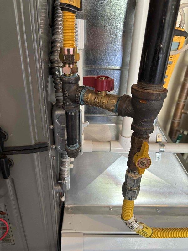 Completed preventative maintenance tune-up on a 3-4 year old Rheem furnace located in garage closet. Performed comprehensive system inspection including visual examination of heat exchanger, burner assembly, and all gas line connections. Tested and verified proper operation of gas valve, ignition system, and flame sensor. Conducted electrical diagnostics using digital multimeter to check voltage and amperage readings on blower motor and control board. Inspected all supply and return ductwork connections for proper sealing. Verified proper venting and combustion air supply. System operating within manufacturer specifications with no issues identified at time of service.