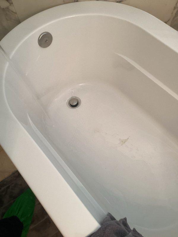 Completed comprehensive Green Shield membership plumbing inspection of residential property. Inspected bathroom fixtures including sink with three-piece brushed nickel faucet assembly, verified proper water flow and drainage operation, and examined bathtub with overflow drain system and stopper mechanism. Assessed 4-year-old tanked water heater located in basement as part of recurring preventative maintenance program.