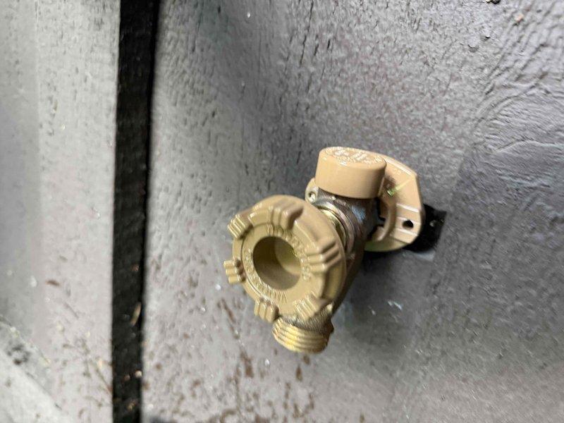 Replaced leaking front yard hose bib with new brass fixture, securing it to exterior wall with proper mounting hardware. Verified all threaded connections were sealed and tested for leaks to ensure proper operation.