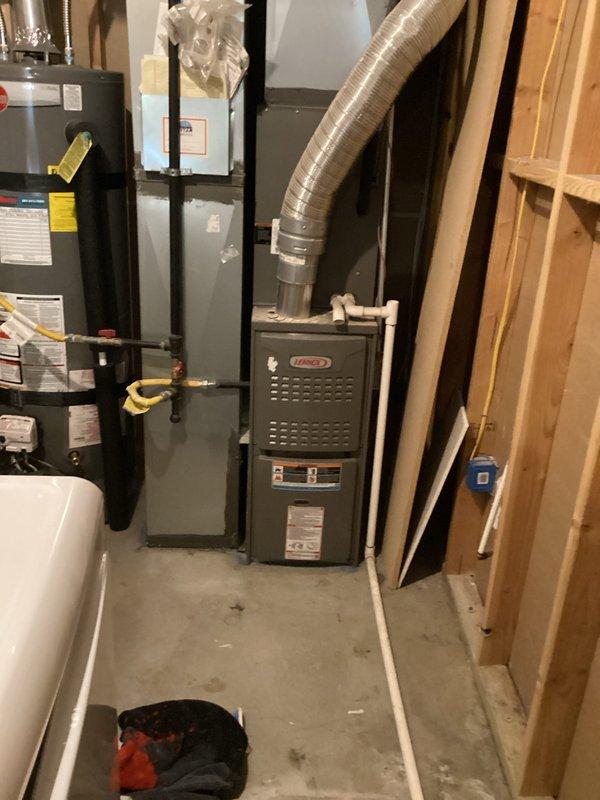 Completed scheduled heating maintenance on multi-system residential property with four HVAC units, focusing on the two full systems covered under membership plan. Performed comprehensive inspection and maintenance on Lennox furnace unit located in basement utility room, including combustion analysis using diagnostic equipment which showed readings of 110°F and 187°F with proper CO and CO2 levels. Inspected 3-month-old system recently installed and 11-year-old existing system, checking all components, filters, and operational parameters. Verified proper operation of ground-level AC units, upstairs controllers, and basement/top floor equipment locations. All systems operating within normal specifications and ready for heating season.