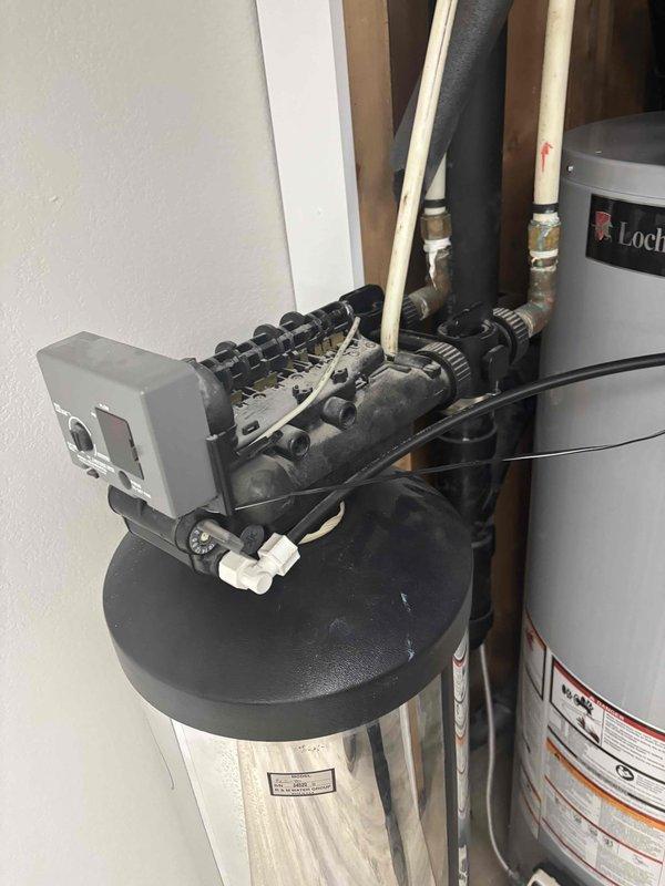 Responded to no hot water complaint on 6-month-old tanked water heater located in basement that would not stay lit. Inspected unit and assessed overall system condition including connections and venting. Documented equipment installation and surrounding plumbing components. Evaluated whether unit could be repaired or required replacement and provided recommendations to restore hot water service to the home.
