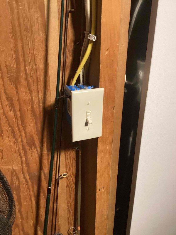 Responded to reported electrical hazard involving blistering wires for tankless water heater installation near light switch location. Upon inspection, found improper wiring methods with exposed conductors and inadequate connections at switch box on wooden wall framing. Corrected electrical rough-in by properly securing Romex cables to studs, installed code-compliant junction box, and made secure wire connections using appropriate connectors. Ensured all conductors were properly terminated and protected within electrical boxes to eliminate fire hazard and bring installation up to current electrical code standards.