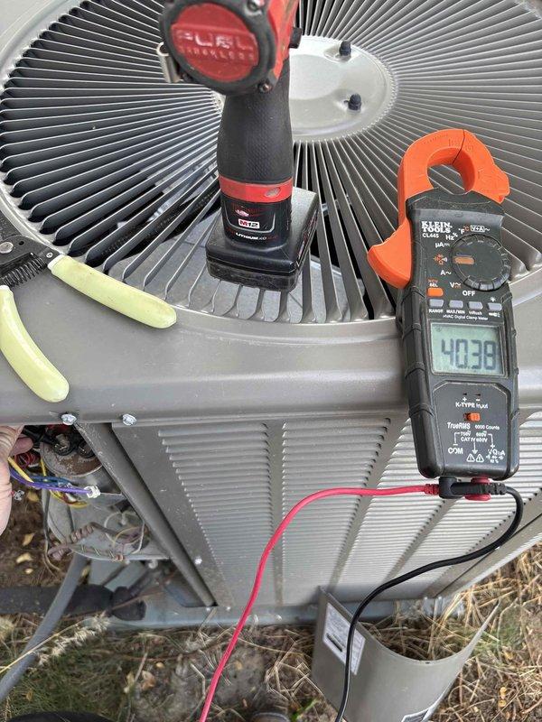 Responded to no cooling complaint on 5-6 year old heat pump system with outdoor condenser and basement furnace. Performed diagnostic evaluation using digital manifold gauges and clamp meter to assess system pressures, temperatures, and electrical performance on R410A unit. Accessed condenser wiring and components, measured operating parameters including suction/discharge temperatures and amp draw to identify root cause of cooling failure.