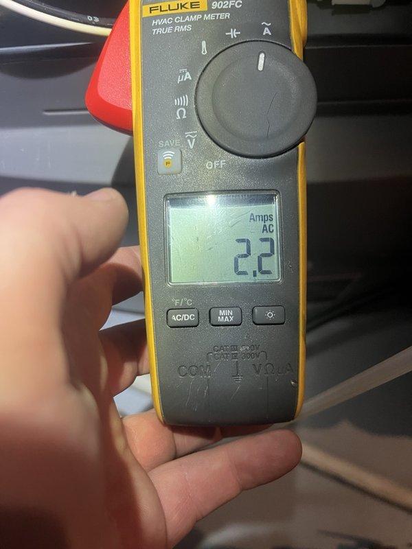 Responded to second opinion request for 5-6 year old furnace in basement with concerns about improper sealing and potential gas leakage reported by another contractor. Performed comprehensive inspection of furnace unit, measuring electrical amperage at 2.2 amps AC using clamp meter and conducting pressure diagnostics with dual port manometer showing -8.14 inWG. Evaluated combustion chamber sealing, flue connections, and gas line integrity to assess rust and leakage concerns, providing professional assessment of unit condition and safety status.