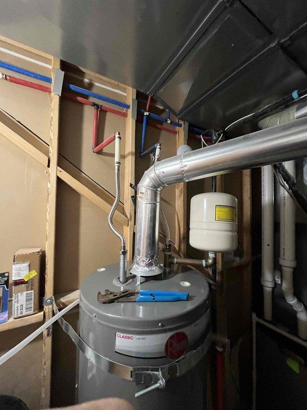 Completed annual plumbing maintenance inspection as part of membership benefits, including water pressure testing, water purity analysis, and water heater flush on a Classic brand water heater located in the basement utility room. Inspected approximately 2-year-old water heater system with expansion tank, verified proper operation of all connections, flexible supply lines, and associated plumbing components. All systems found to be functioning within normal parameters with no immediate repairs required.