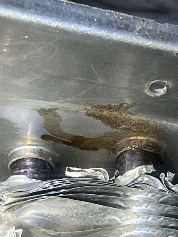 Performed second opinion diagnostic on recently installed furnace system following concerns about previous contractor's diagnosis of failed secondary heat exchanger. Conducted thorough inspection of new furnace installation, verifying proper equipment setup and operation. Examined condensate drain pan, noting evidence of moisture accumulation and staining consistent with normal condensation drainage patterns. Verified furnace levelness using precision leveling tools to ensure proper condensate flow and drainage function. Assessed overall installation quality, equipment operation, and system performance to provide homeowner with independent evaluation of heating system condition and installation workmanship.