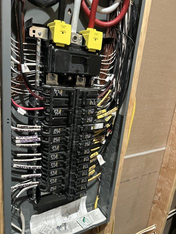 Completed routine electrical maintenance inspection as part of membership plan for first-time service at this location. Performed comprehensive safety check of main electrical panel, verified proper circuit breaker operation across all positions, inspected wire management and labeling system, and confirmed all connections at bus bars and terminal blocks were secure. Panel showed professional installation with organized wire bundling, proper circuit identification labels, and adequate knockout covers in place; hot tub circuit breakers were identified and verified operational with wall labeling present for reference.